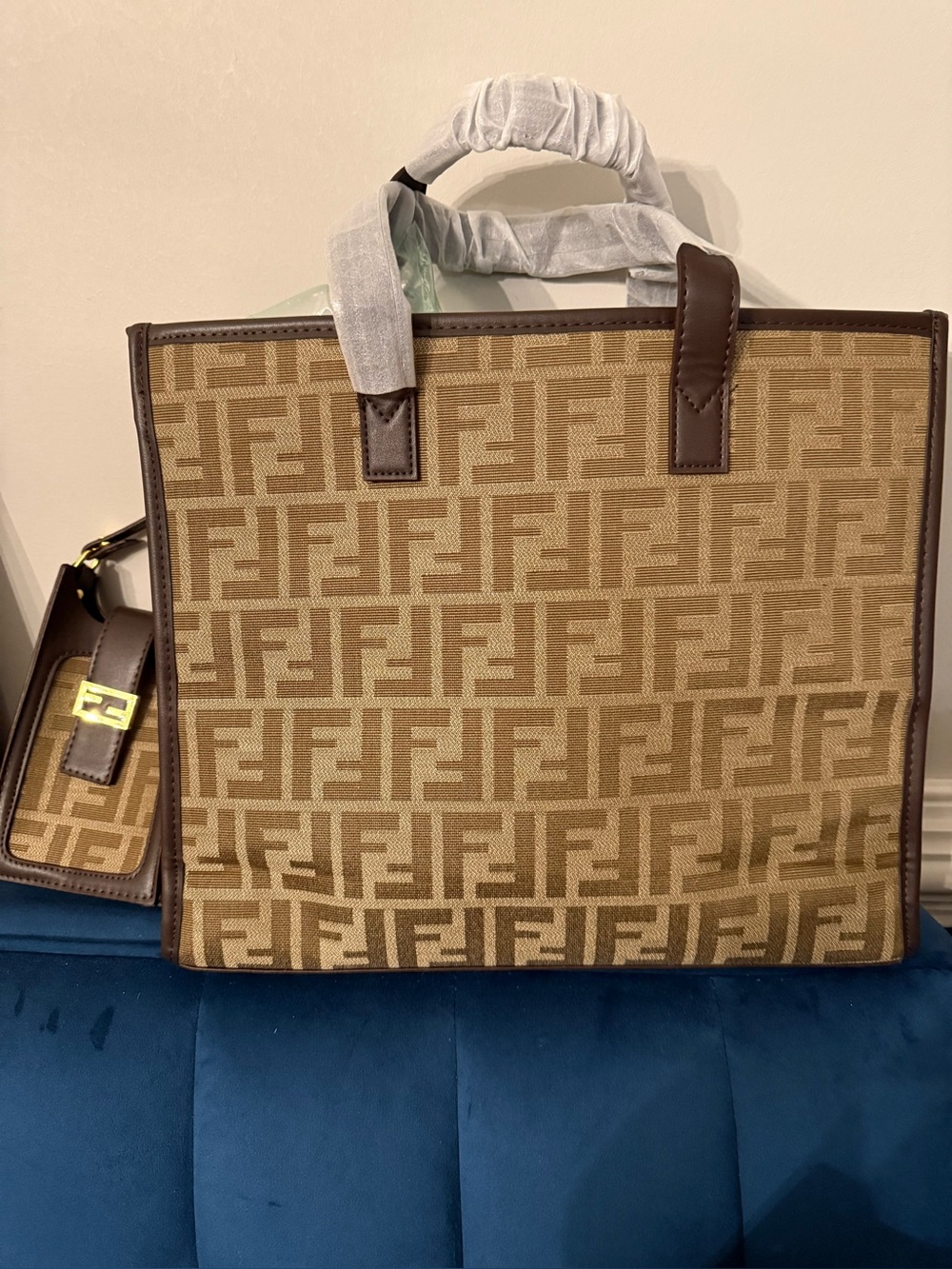 Large brown tote with additional small phone pouch